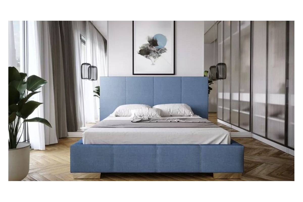 niebieskie łóżko z przeszyciami 