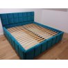 Niebieskie łóżko tapicerowane z pojemnikiem Aron